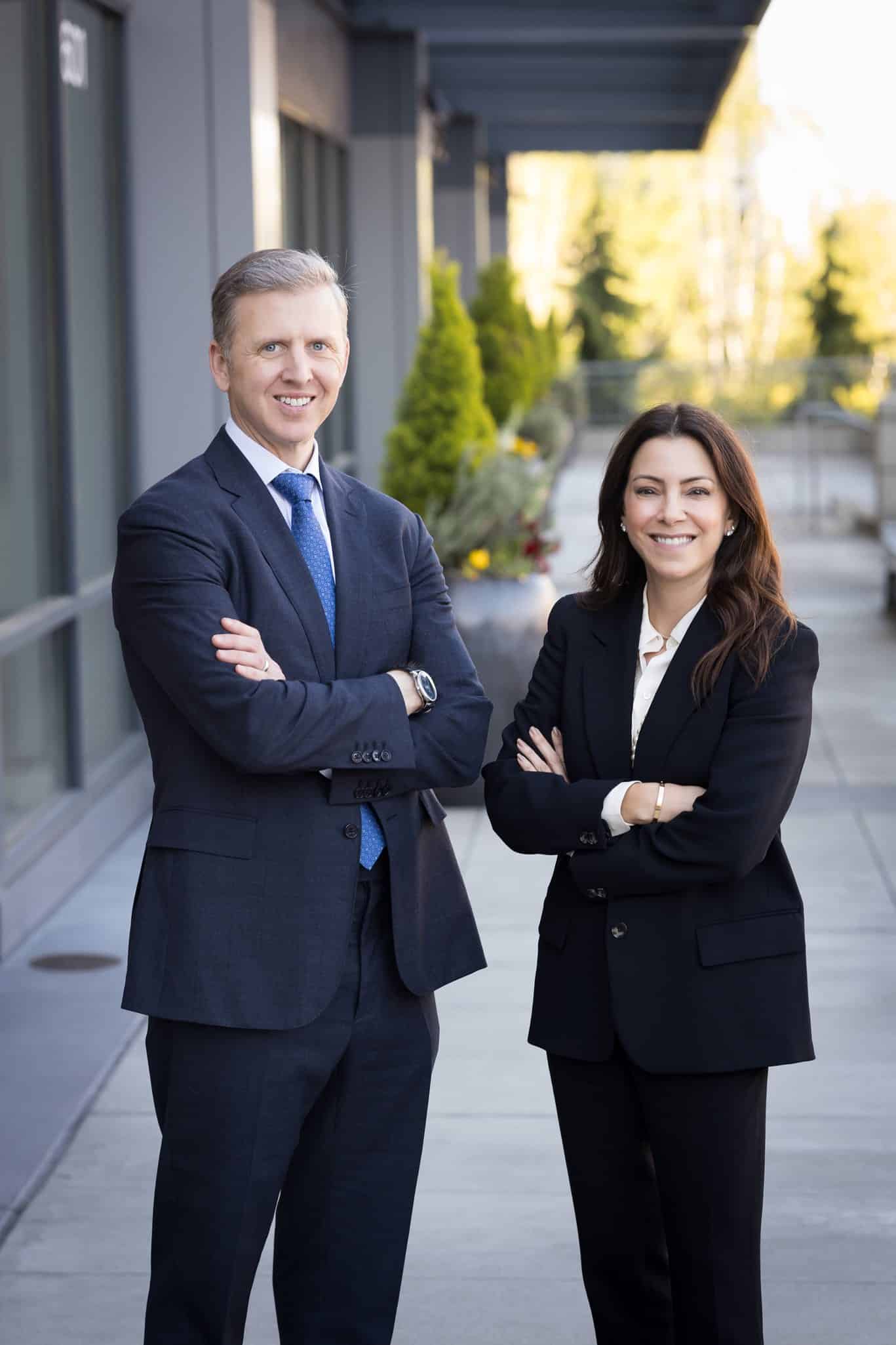 Court and Michelle standing outside their Seattle criminal defense law office