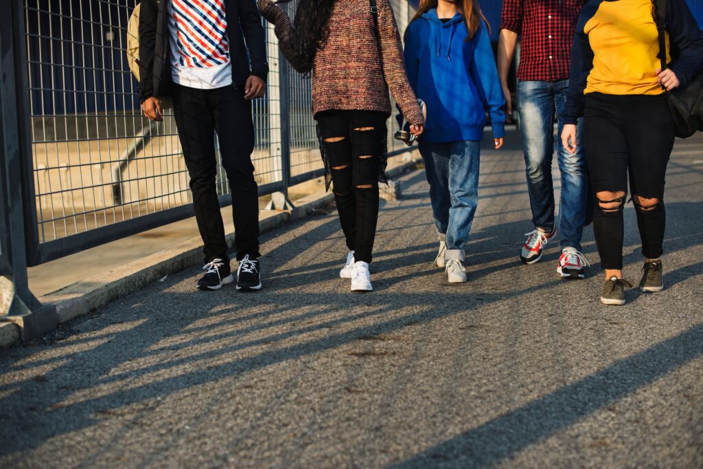 Youth walking through alley of a construction space